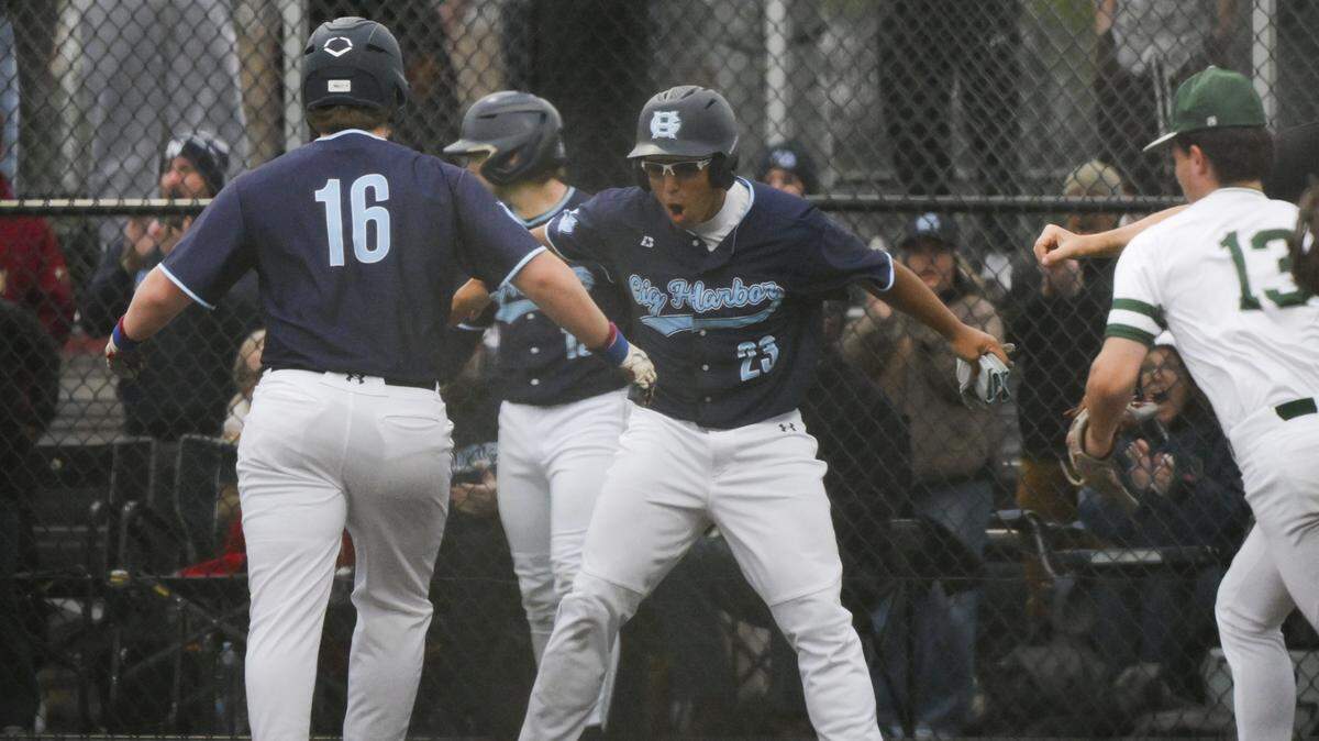 Gig Harbor's Jake Cuda (16) celebrates a run against Peninsula during the 3A Puget Sound League baseball league championship game at Lincoln High School, on Wednesday, May 6, 2026, in Tacoma, Wash.