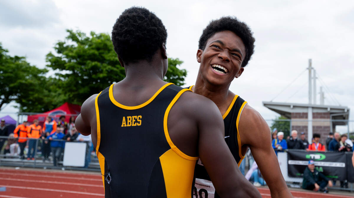 Lincoln’s Eddie Bruner Jr. hugs teammate Immanuel Jordan after Bruner finished first in the 3A boys 400m dash during day 3 of the Track and Field Championship at Mount Tahoma High School, on Saturday, May 25, 2024, in Tacoma, Wash.