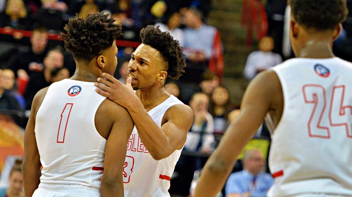Life Christian’s Omari Maulana pumps up Dai’shaun Nichols after Nichols draws an and-1.