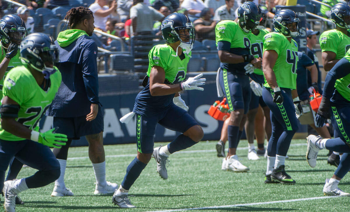 Seahawks cornerback Ahkello Witherspoon loosens up prior to the annual training camp mock game at Lumen Field in Seattle on August, 5, 202.
