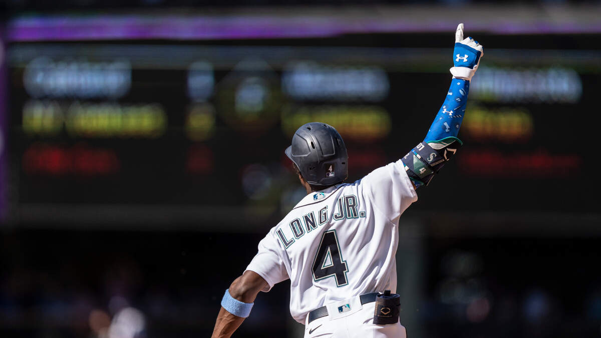 Seattle Mariners’ Shed Long Jr. celebrates as he rounds the bases after hitting a grand slam off Tampa Bay Rays relief pitcher Diego Castillo that also scored Luis Torrens, Dylan Moore and Jake Bauers during the 10th inning of a baseball game, Sunday, June 20, 2021, in Seattle. (AP Photo/Stephen Brashear)