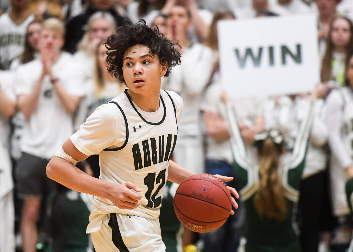 Auburn’s Maleek Arington looks to pass during the fourth quarter. Kentwood played Auburn in a basketball game at Auburn High School in Auburn, Wash., on Friday, Feb. 7, 2020.