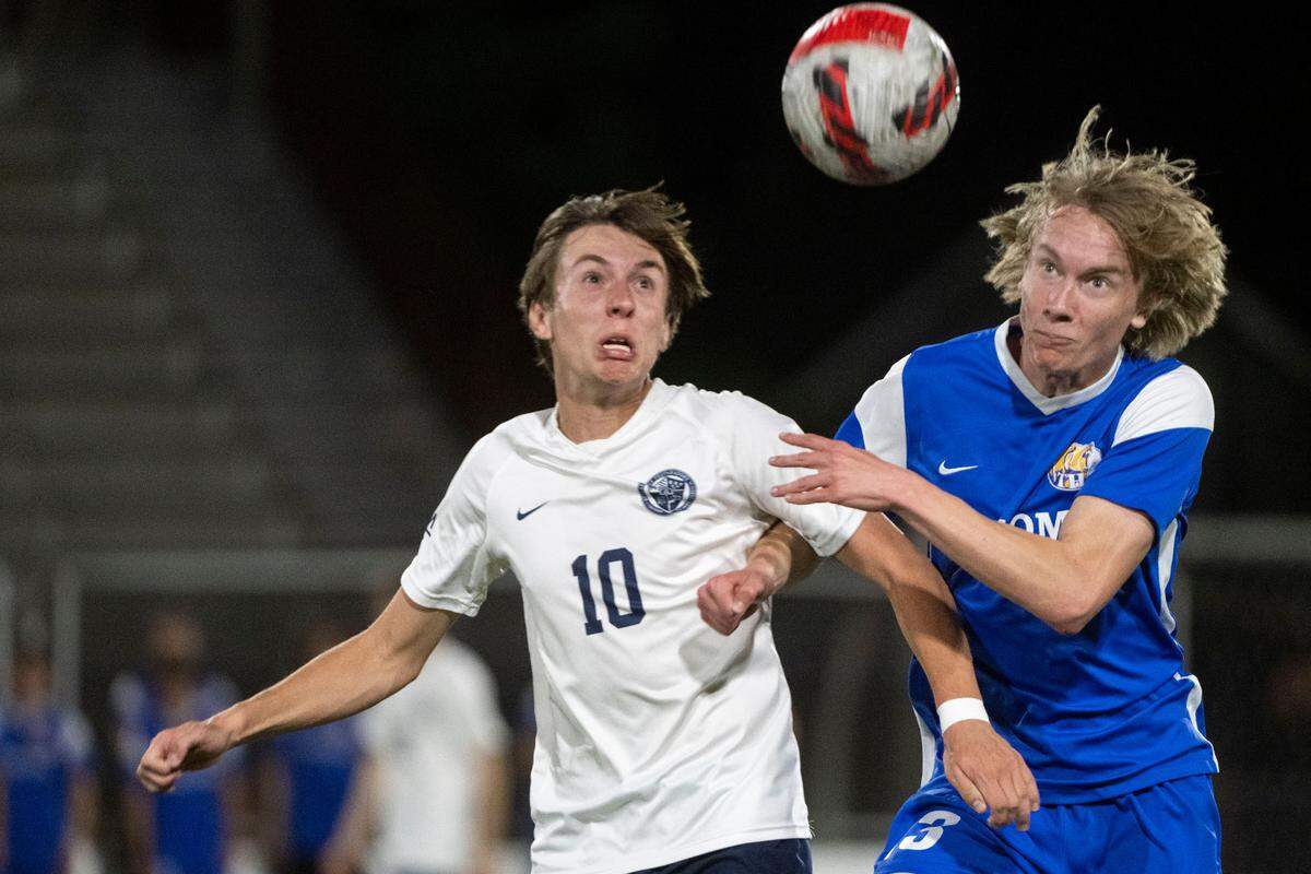 Tahoma’s Liam Stewart fights for positioning with Bellarmine Prep’s Dane Price as they try to gain possession of a loose ball in the second half of the 4A West Central/Southwest district soccer championship game on Thursday, May 11, 2023, at Sparks Stadium in Puyallup, Wash.