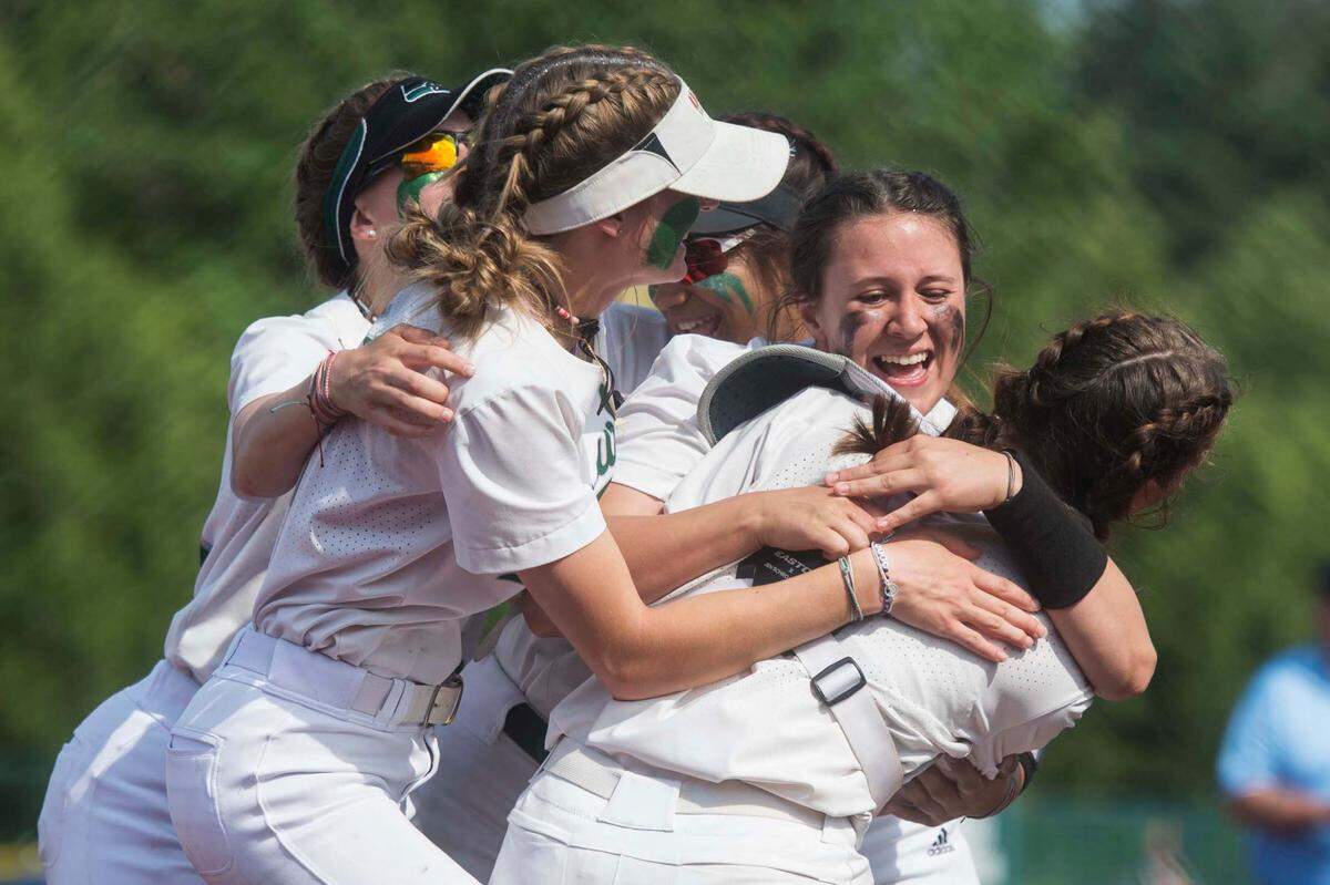 Peninsula starter Alli Kimball celebrates with teammates following a shutout win over Bonney Lake in the Class 3A West Central/Southwest district softball championship game on Saturday, May 20, 2023 at the Regional Athletic Complex in Lacey, Wash.