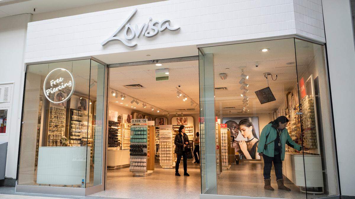 Customers shop at Lovisa, a new jewelry store that opened on Nov. 9, 2022, in the Tacoma Mall. Photographed on Nov. 10, 2022.
