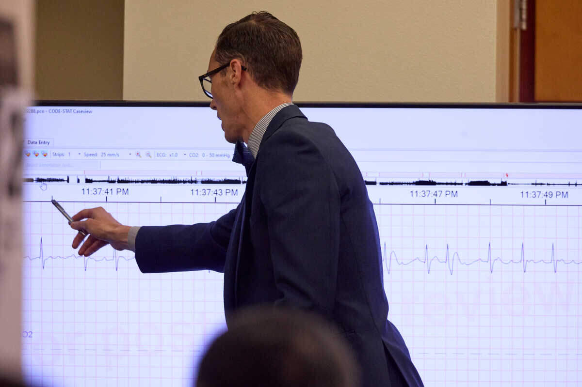 Attorney Mark Conrad points to an EKG as he questions Dr. Daniel Wohlgelernter, a cardiologist from Santa Monica, Calif., during the trial of Tacoma Police officers accused in the death of Manny Ellis held at Pierce County Superior Court, Thursday, Oct. 26, 2023, in Tacoma, Wash. Officers Christopher Burbank, Matthew Collins and Timothy Rankine are charged. (John Froschauer / Pool Photo - AP)