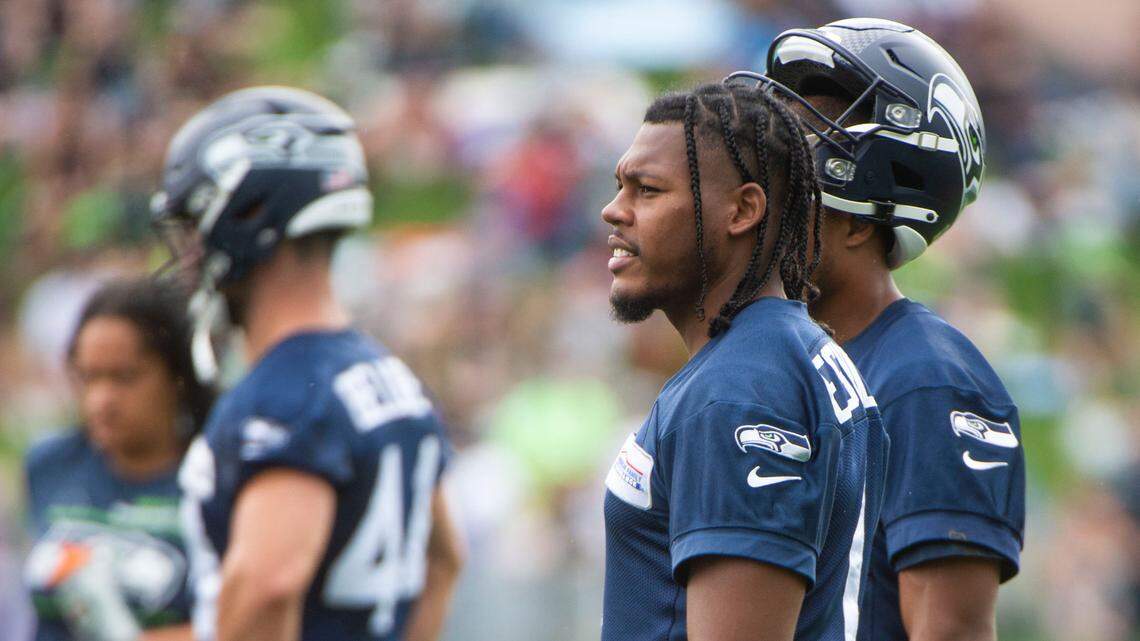 Rookie receiver D’Wayne Eskridge watches the action on fourth day of Seahawks training camp Saturday, July 31, 2021 at the VMAC in Renton.