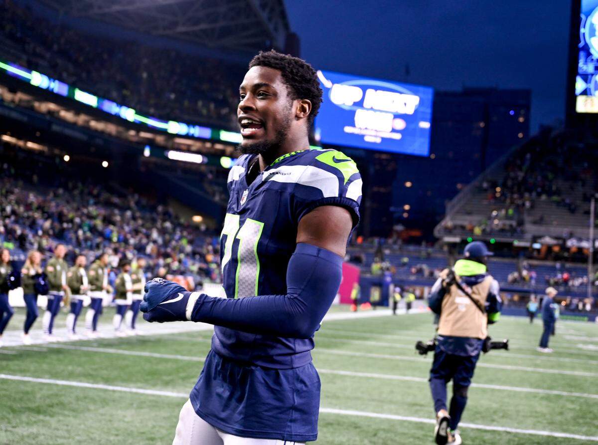 Seattle Seahawks cornerback Devon Witherspoon (21)walks over the field after the Seahawks 29-26 victory against the Washington Commanders at Lumen Field, on Sunday, Nov. 12, 2023, in Seattle, Wash.