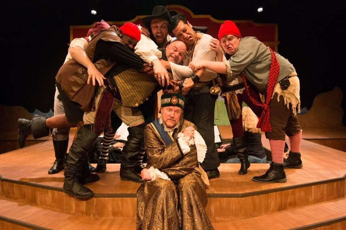 Former Lakewood Playhouse managing artistic director John Munn, center, is embraced by the cast of “Pirates of Penzance” in this June 2017 publicity photo. Munn has now since been accused of harassment and assault by members of the theater.