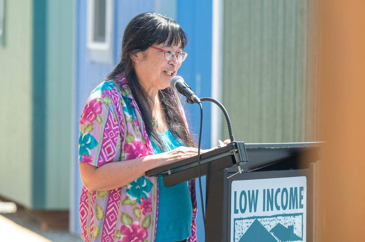 Sharon Lee, founding executive director of the Low-Income Housing Institute (LIHI), speaks at the grand opening event for Kingfisher Village, a new collection of tiny homes operated by LIHI, on Wednesday, July 23, 2025, in Tacoma.