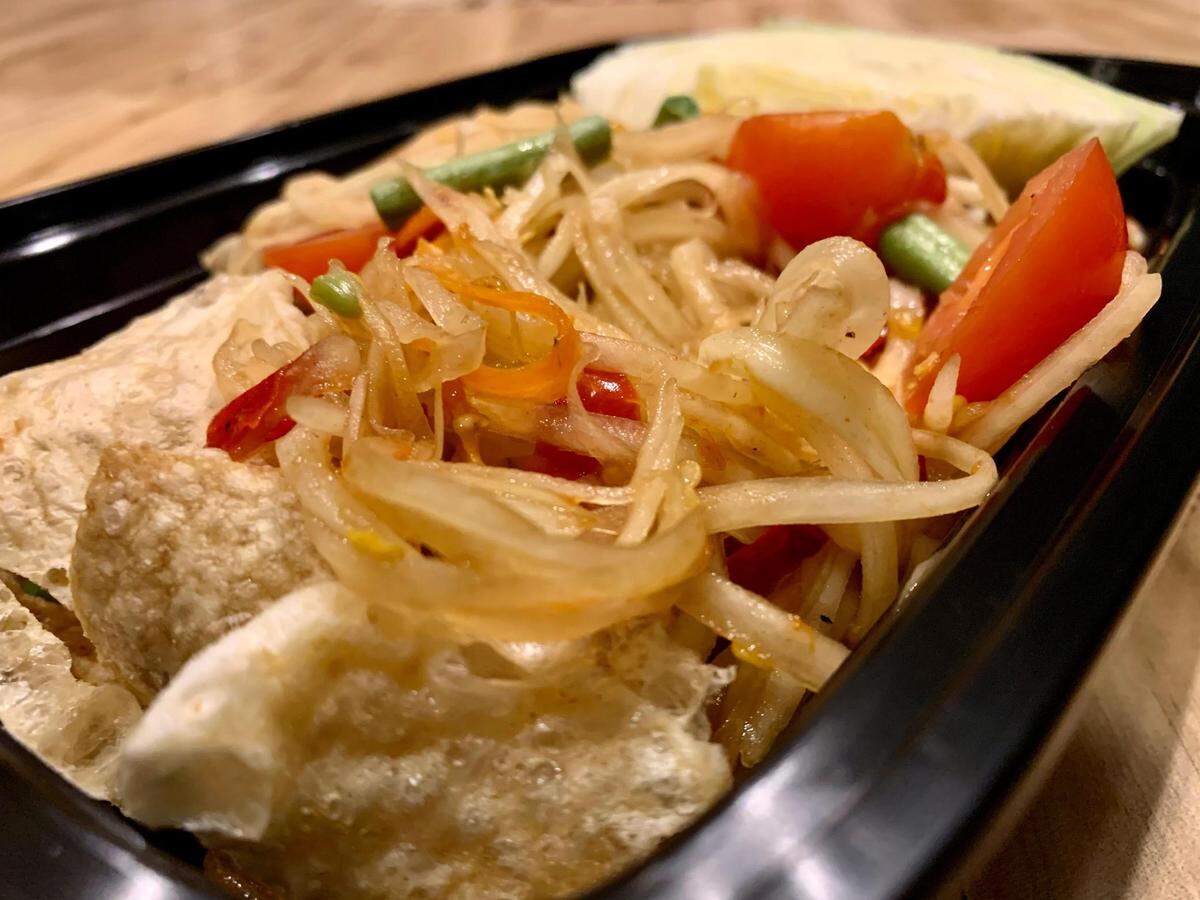 The menu at Sweet Rice in Tacoma’s South End leans into the owners’ Lao roots, noticeable in this very funky papaya salad. Though prevalent on Thai restaurant menus topped with crush peanuts, the dish’s origins lie in the neighboring country.