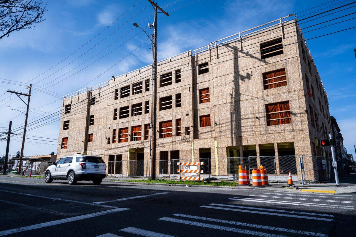 A building is under construction to become affordable housing units for members of the Hilltop community and people of Tacoma at 1124 Martin Luther King Jr. Way on Thursday, March 24, 2022 in Tacoma, Wash.