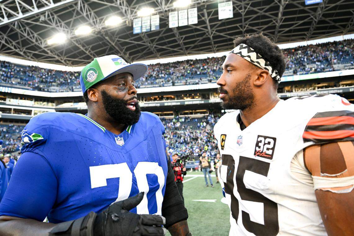 Seattle Seahawks offensive tackle Jason Peters (70) and Cleveland Browns defensive end Myles Garrett (95) talk after the Seahawks 24-20 victory at Lumen Field, Sunday, Oct. 29, 2023, in Seattle, Wash.