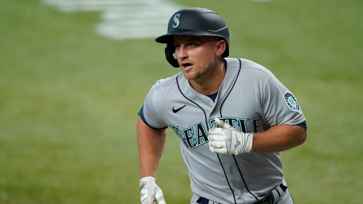 Seattle Mariners’ Kyle Seager crosses the plate after hitting a two-run home run during the first inning of the team’s baseball game against the Texas Rangers in Arlington, Texas, Saturday, July 31, 2021. (AP Photo/Tony Gutierrez)