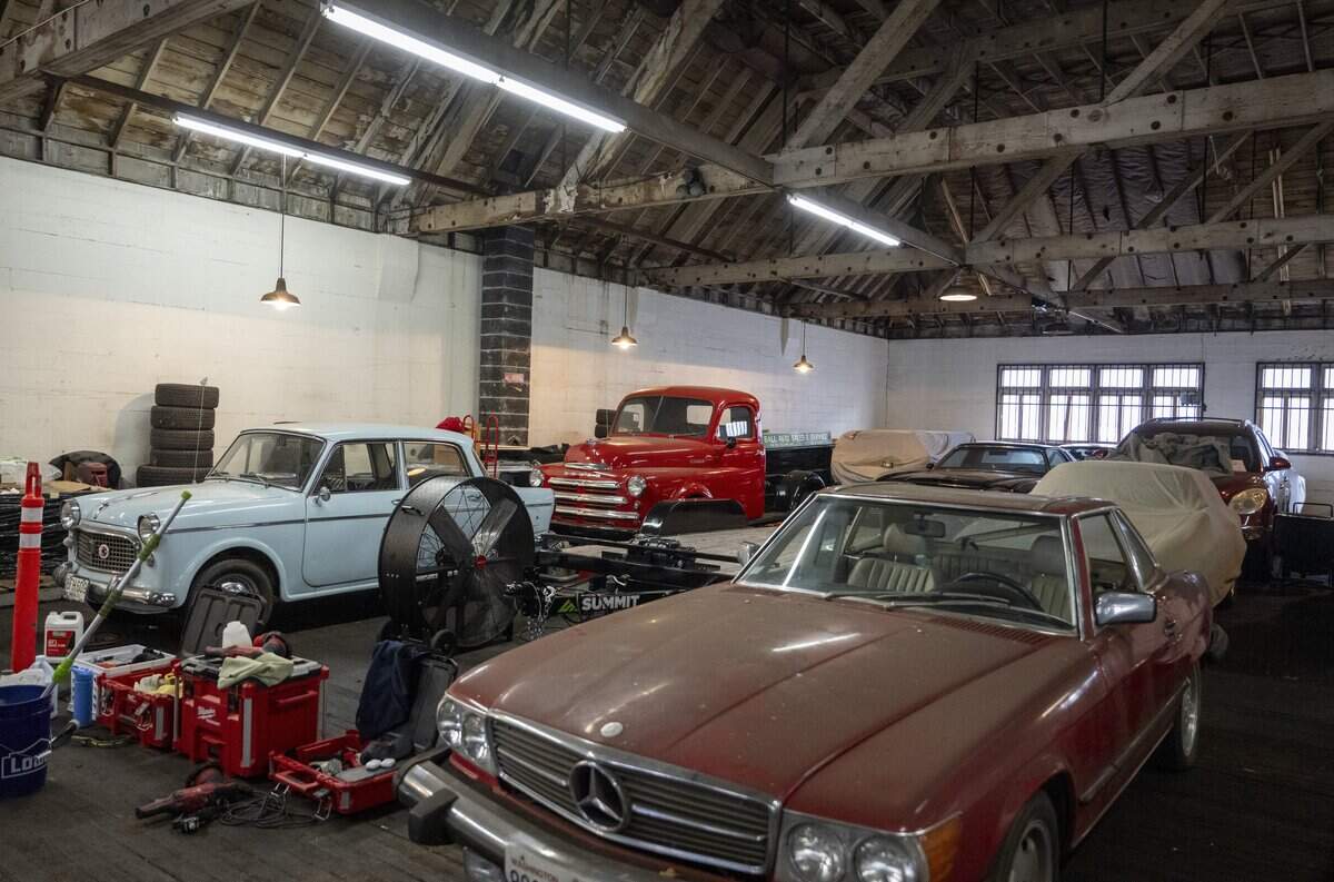 Cars fill the interior of Ball Auto, which operates out of its original building 80 years later, on Monday, June 29, 2026, in Tacoma, Wash.