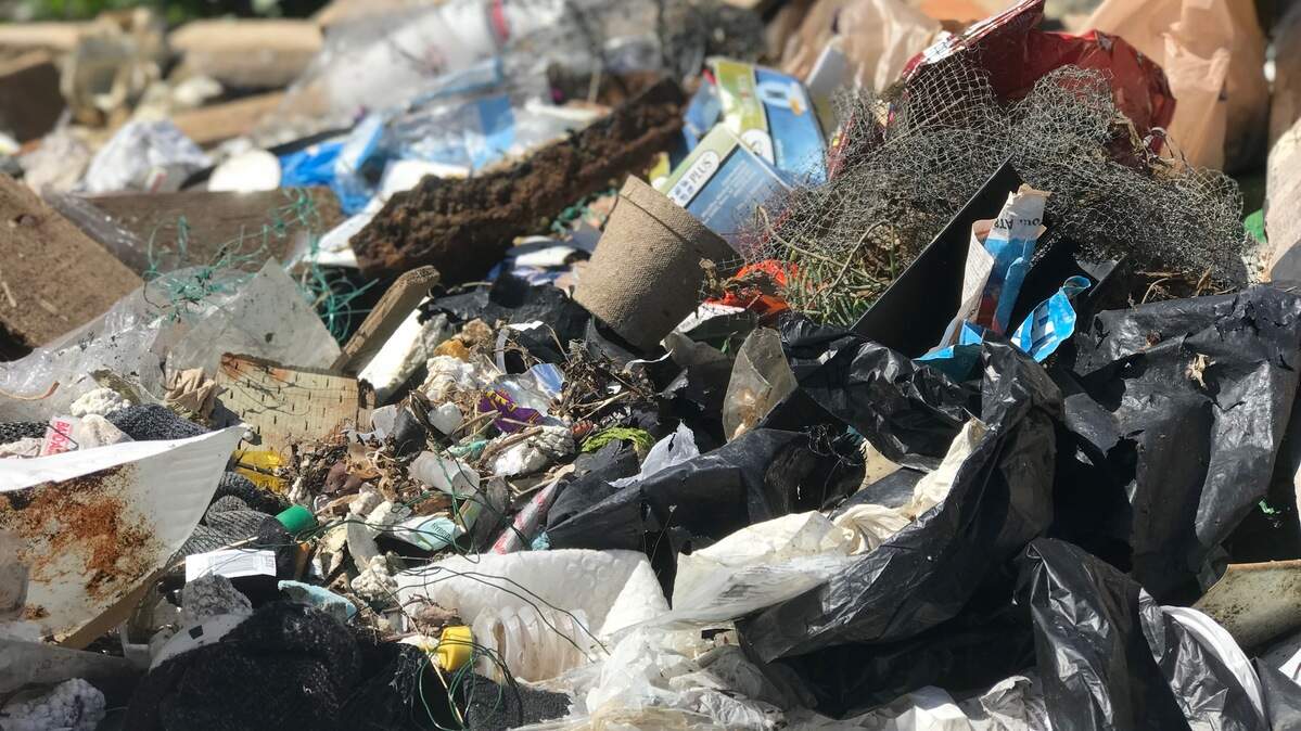 Close up of debris (fish netting, single-use plastics, tires, treated wood with rusty metal) picked up along the Purdy Spit during a recent volunteer beach cleanup on World Ocean Day.