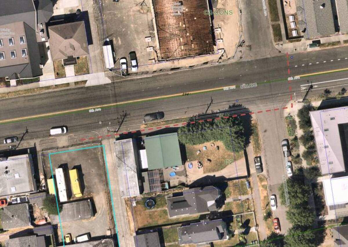 An aerial of a proposed apartment site supplied by the City of Tacoma shows the project site (outlined at bottom left side) and the nearby intersection curb improvements required of the developers.