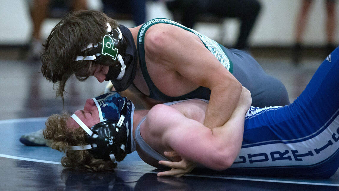 Masked and tested, high school wrestling teams ready to grapple