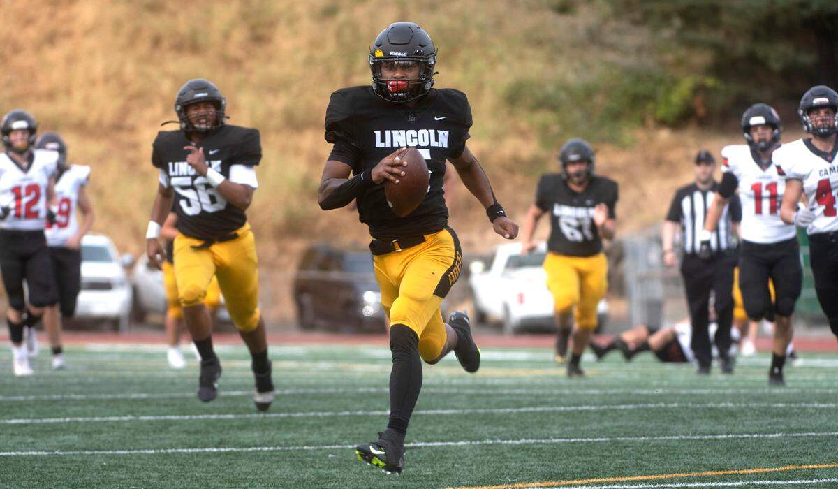 Lincoln quarterback Gabarri Johnson breaks loose for a his second touchdown run against the Camas Papermakers during Saturday afternoon’s 4A football game at Lincoln Bowl in Tacoma, Washington, on Sept. 17, 2022.