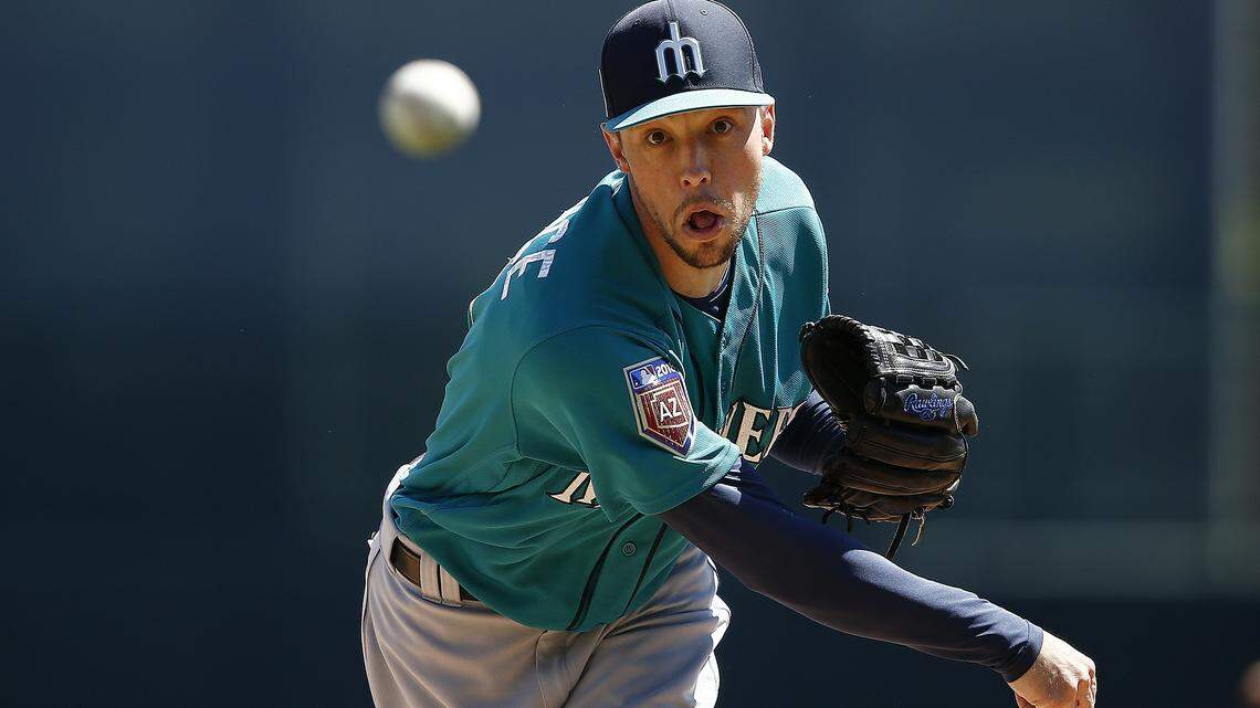 Seattle Mariners pitcher Casey Lawrence warms up during the first inning of a spring training baseball game against the Chicago White Sox Friday, March 23, 2018, in Glendale, Ariz. The Mariners and White Sox game ended in a 5-5 tie. (AP Photo/Ross D. Franklin)