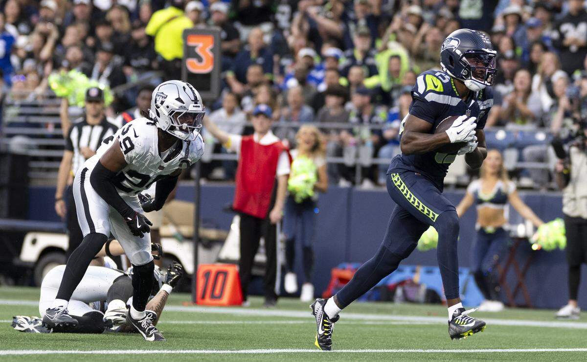 Seattle Seahawks wide receiver Tory Horton (15) scores a touchdown during the second quarter of the game against the Las Vegas Raiders at Lumen Field, on Thursday, Aug. 7, 2025, in Seattle, Wash.