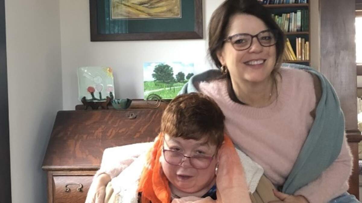 Karen Irwin (right) and sister Jennifer on Christmas morning 2019, months before life was turned upside down by coronavirus.