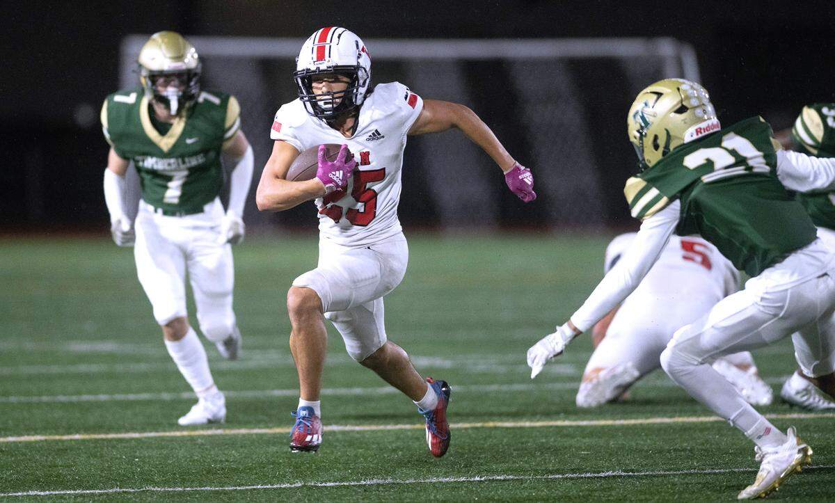Yelm kick returner Anthony Kiamco breaks loose between Timberline defenders Josiah Gorman (left) and Kai Thomas during Friday night’s 3A SSC football game at South Sound Stadium in Lacey, Washington, on Oct. 13, 2023. Yelm won the game, 54-7.