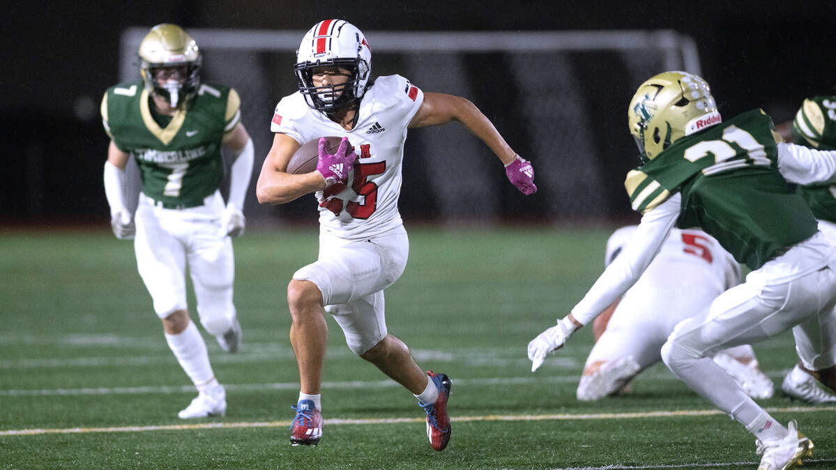 Yelm kick returner Anthony Kiamco breaks loose between Timberline defenders Josiah Gorman (left) and Kai Thomas during the 3A SSC football game at South Sound Stadium in Lacey on Oct. 13. Yelm won the game, 54-7.