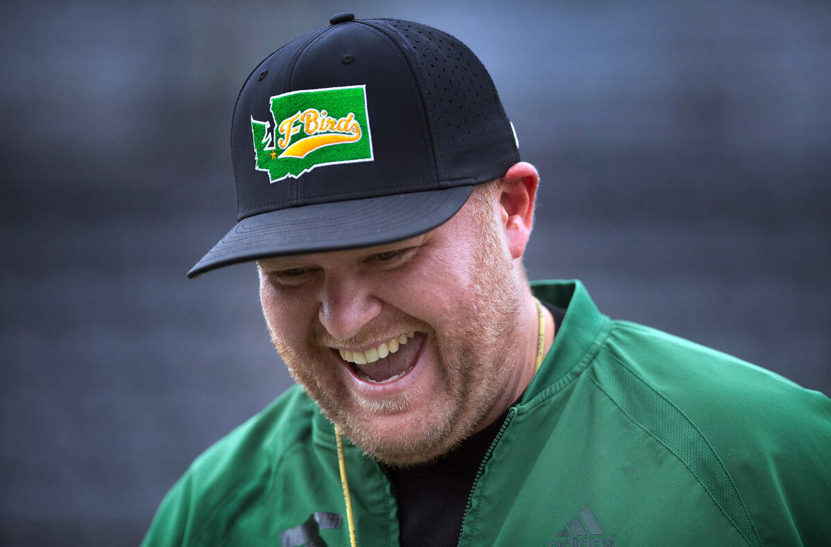 Tumwater head coach William Garrow laughs with his T-Bird players during preseason football practice at Tumwater District Stadium in Tumwater, Washington, on Thursday, Aug. 22, 2024.