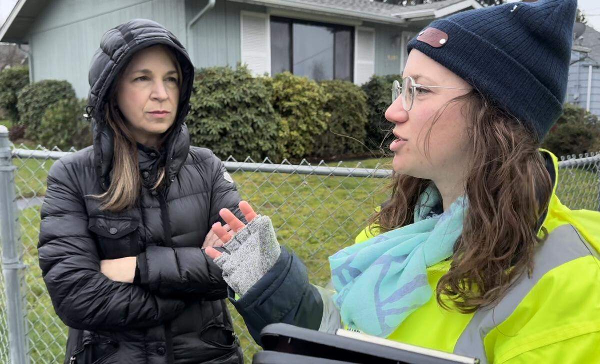 Commissioner of Public Lands Hilary Franz, left, listens to safe routes to school coordinator Cailin Henley during a walking tour around Mann Elementary School in Tacoma on Wednesday.