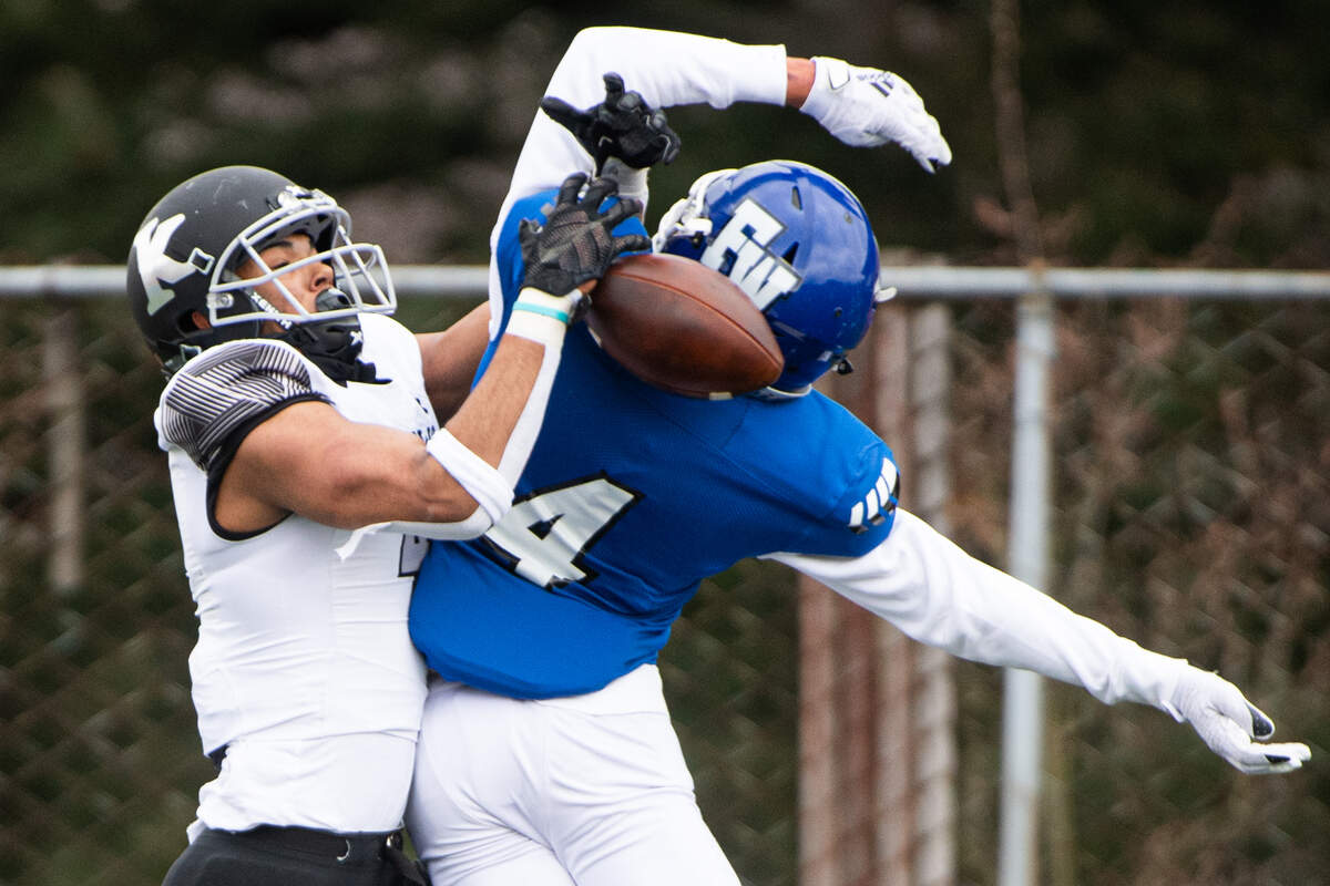 Federal Way’s Jaylon Jenkins defends a pass intended for Kentwood’s Gabriel Ogunleye during the second quarter. Federal Way played Kentwood in a football game at Federal Way High School in Federal Way, Wash., on Saturday, March 20, 2021.