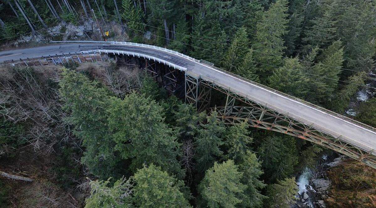 The Carbon River Fairfax Bridge connects state Route 165 to Mount Rainier National Park. The bridge is closing permanently due to safety concerns from the steel deteriorating. The rust is visible underneath the bridge in this photo.