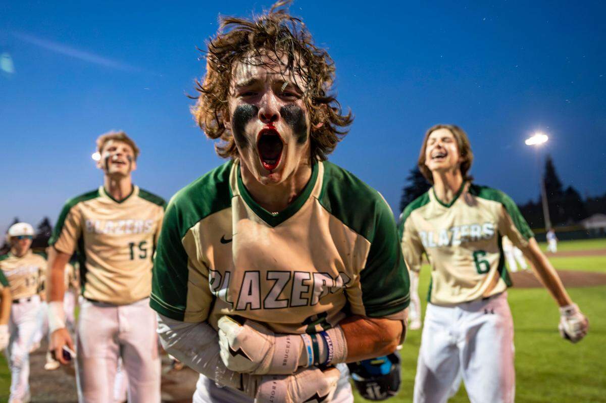 Timberline’s Gage Reeser celebrates after his game-winning single in the bottom of the seventh inning helped the Blazers to a 7-6 come-from-behind win in the 3A West Central/Southwest district baseball championship game at Auburn High School on Saturday, May 13, 2023, in Auburn, Wash.
