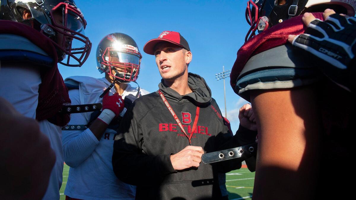Bethel head coach Mark Iddins directs the Braves during football practice at Art Crate Field in Spanaway on Wednesday, Nov. 20, 2019.