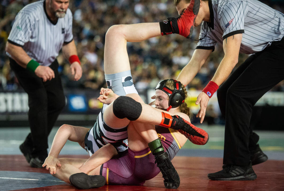 White River’s Claire Dicugno tries to pin Union’s Riley Aamold during the 125 pound championship during day two of Mat Classic XXXII at the Tacoma Dome in Tacoma, Wash., on Saturday, Feb. 22, 2020.