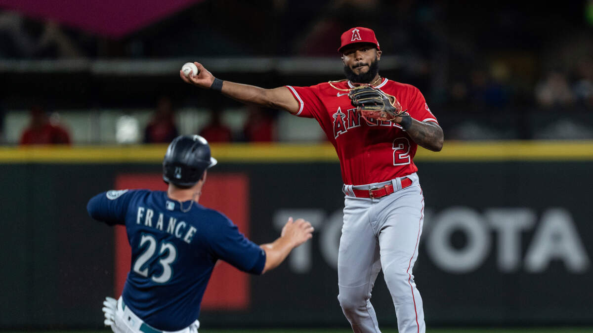 Los Angeles Angels second baseman Luis Rengifo turns a double play after forcing out Seattle Mariners’ Ty France at second base on a ball hit by Eugenio Suarez during the sixth inning in the second game of a baseball doubleheader Saturday, Aug. 6, 2022, in Seattle. (AP Photo/Stephen Brashear)