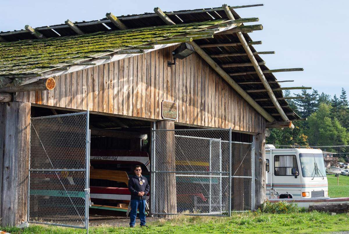Lummi Nation Chairman Lawrence Solomon stands in front of the Tribe’s canoe shed on the Stommish grounds, land that his family owned for generations, on Friday, Oct. 1. His great-grandmother Edith Jones and her husband Vic held the first Stommish in 1946 in honor of their two sons, Bill and Stanley Solomon, and other Lummi veterans who returned home from World War II. Chairman Solomon, a Navy veteran and leader of the Blackhawk Singers, is currently in his second year as chairman for the Tribe.