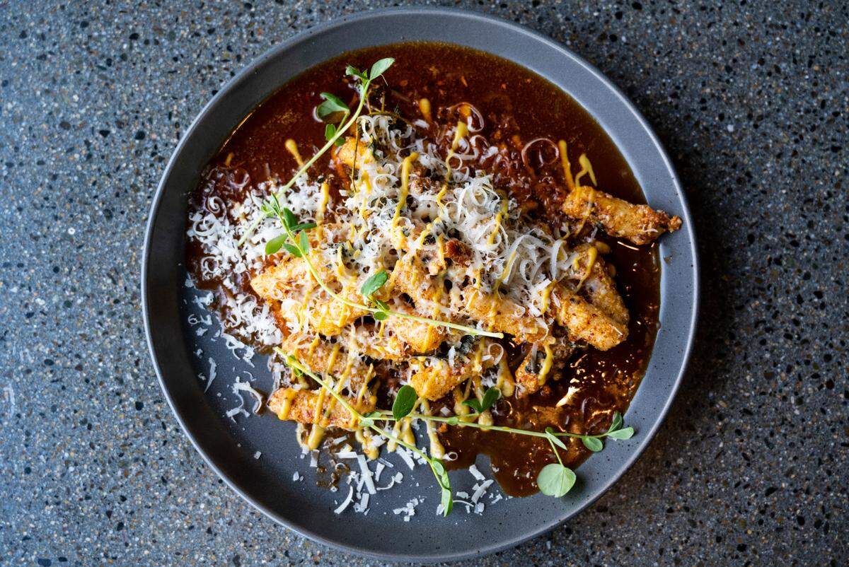 At Sig Brewing Co. in Tacoma, Wash., executive chef Hailey Hernandez spins dishes high on flavor and fun. Her version of tteokkbokki, Korean rice cakes typically simmered in a a spicy gochujang sauce, uses browned butter, sage, thyme, and parmesan on Friday, March 4, 2022.