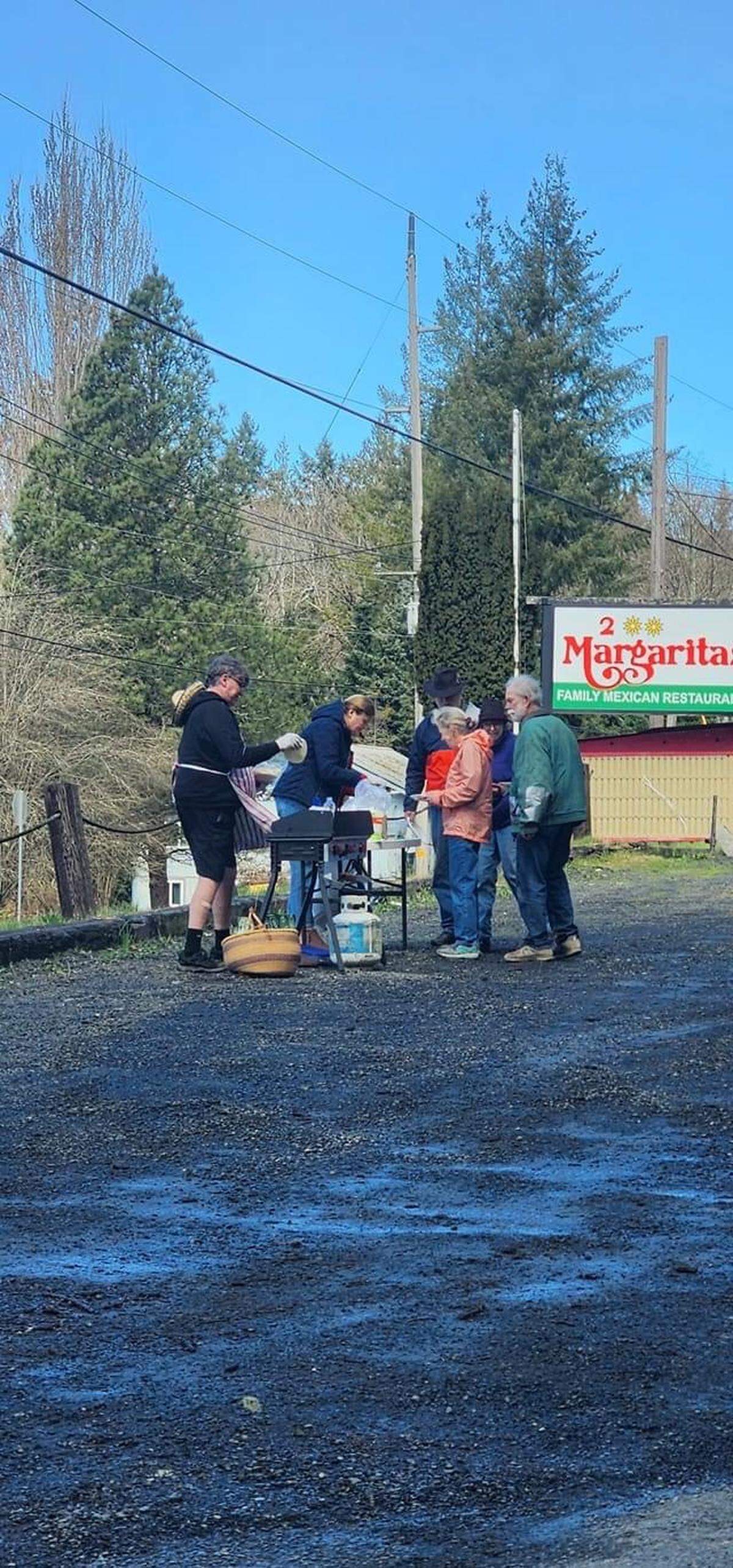 Key Peninsula residents line up for free tacos in the 2 Margaritas parking lot.