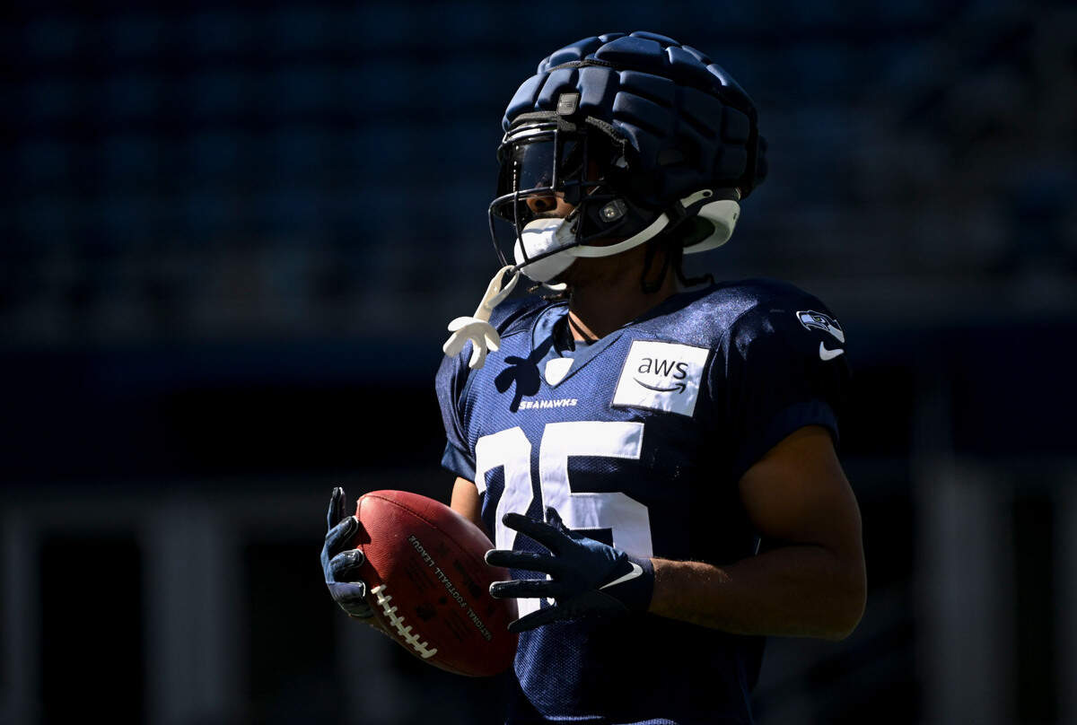 Seattle Seahawks running back Kenny McIntosh (25) runs drills during warm-ups before the mock game at Lumen Field, Friday, Aug. 4, 2023, in Seattle, Wash.