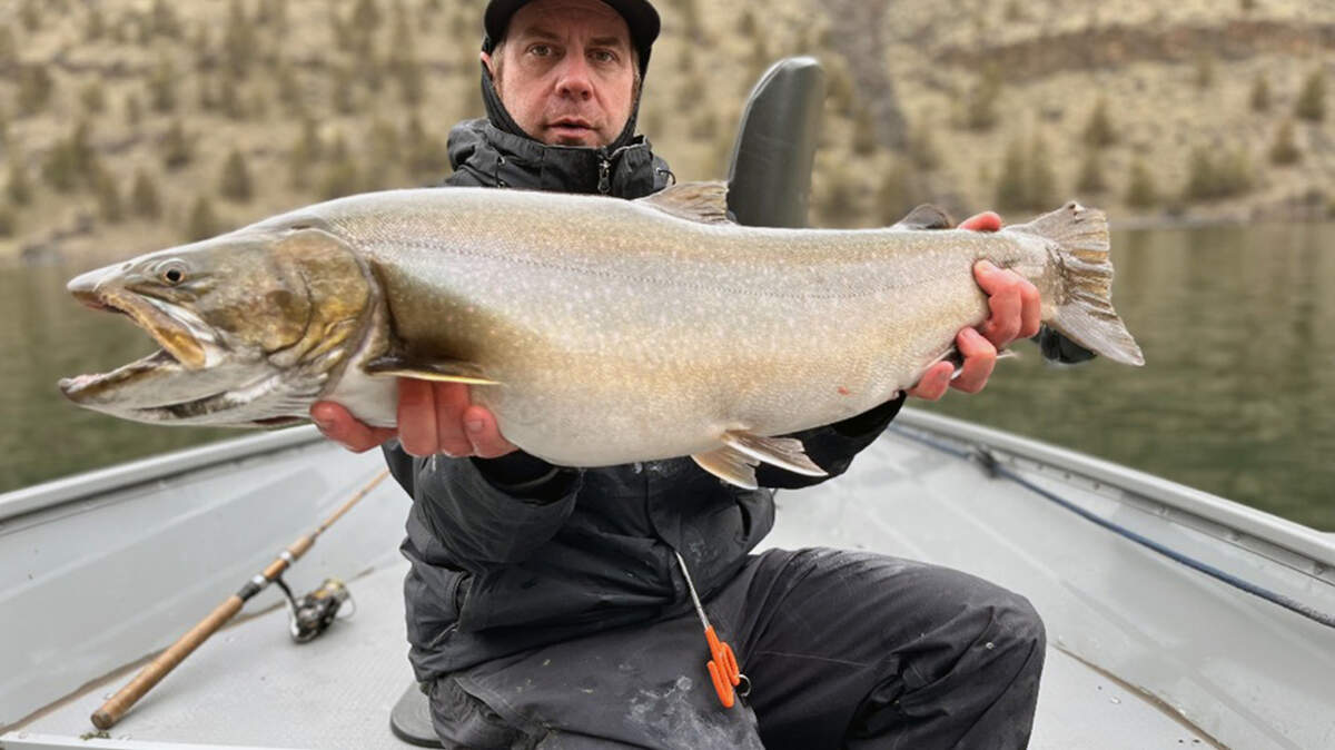 Ryan Mejaski from Bend, Oregon, caught a bull trout April 8 in Lake Billy Chinook. He released the massive fish before seeing if it broke a state record, officials said.