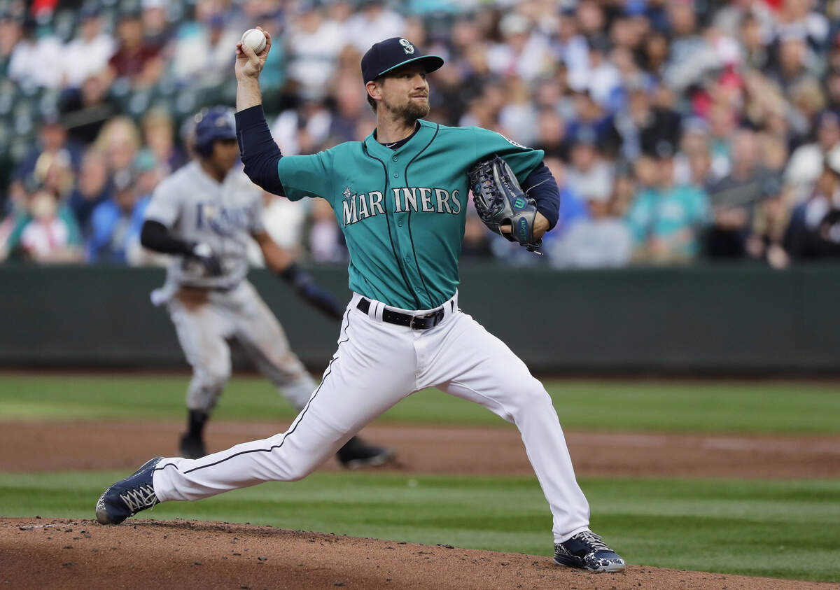 Seattle Mariners starting pitcher Mike Leake throws to a Tampa Bay Rays batter during the first inning of a baseball game Friday, June 1, 2018, in Seattle. (AP Photo/Ted S. Warren)