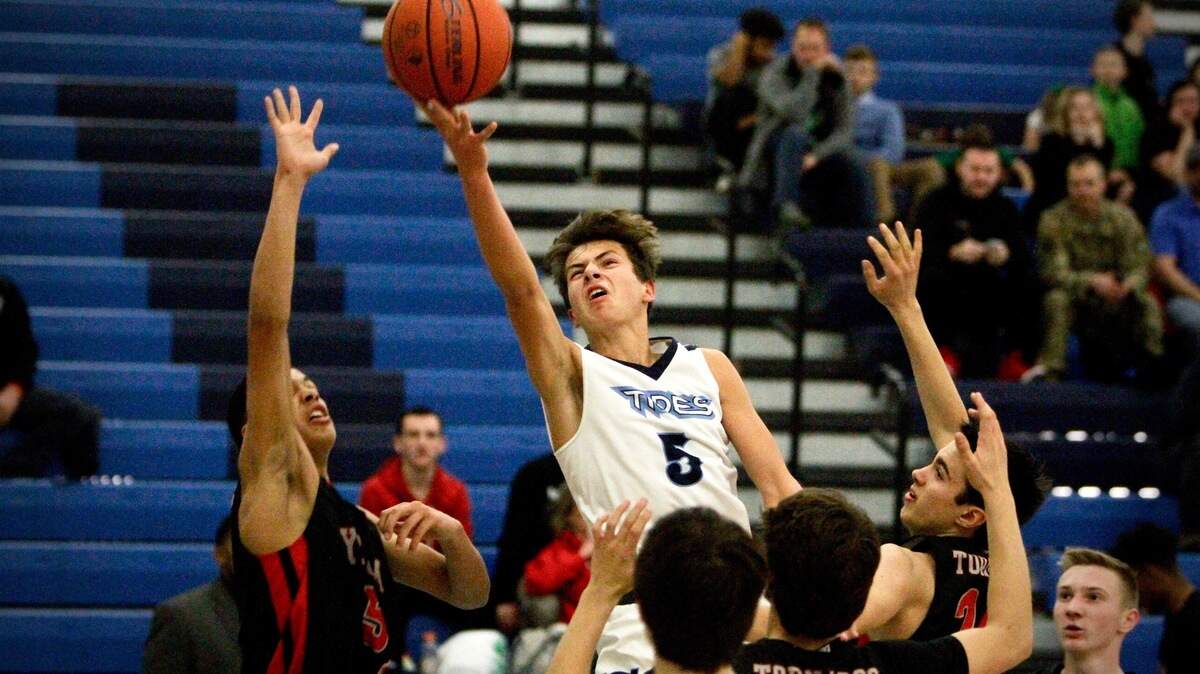 Gig Harbor High School freshman Asher Raquiza drives to the hoop against Yelm on Friday, Jan. 5, 2019.