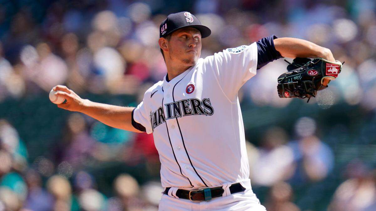 Seattle Mariners starting pitcher Chris Flexen throws against the Texas Rangers in the second inning of a baseball game Sunday, July 4, 2021, in Seattle. (AP Photo/Elaine Thompson)