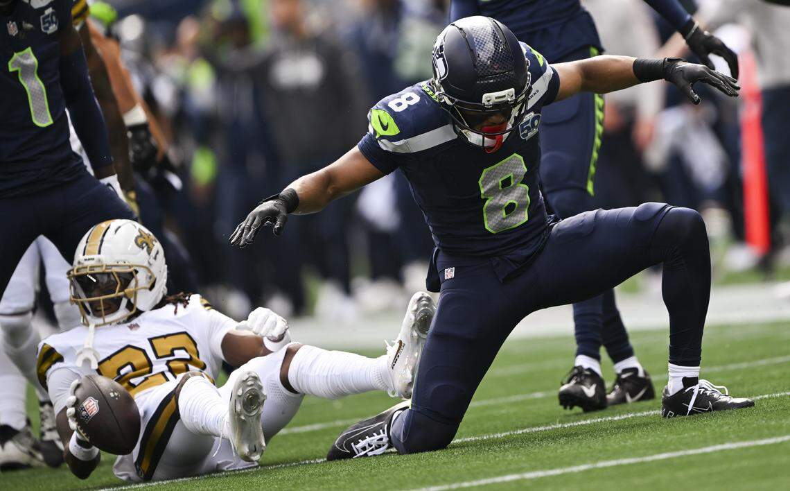Seattle Seahawks safety Coby Bryant (8) reacts to a tackle on New Orleans Saints running back Devin Neal (23) during the first quarter of the game at Lumen Field, on Sunday, Sept. 21, 2025 in Seattle.