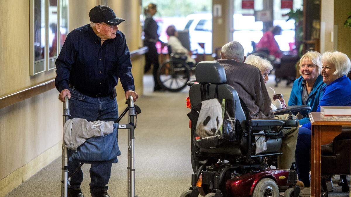 Residents and visitors greet one another at Tacoma Lutheran Retirement Community.