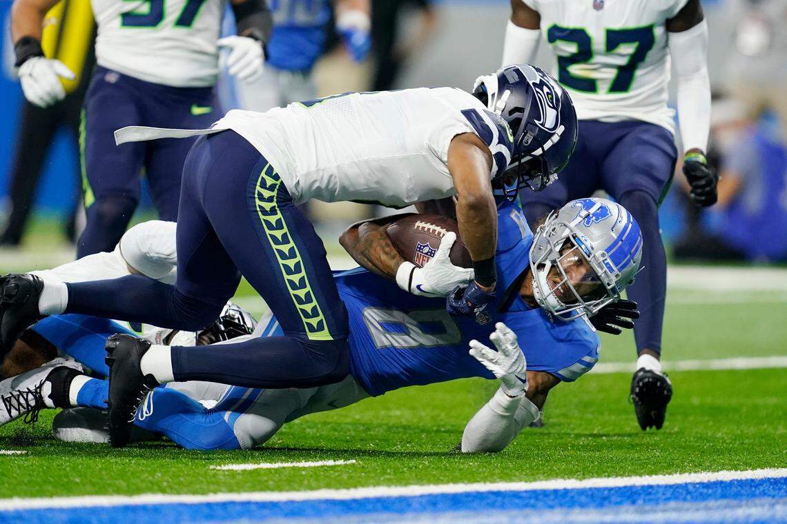 Detroit Lions wide receiver Josh Reynolds is tackled short of the goal line during the first half of an NFL football game against the Seattle Seahawks, Sunday, Oct. 2, 2022, in Detroit. (AP Photo/Paul Sancya)