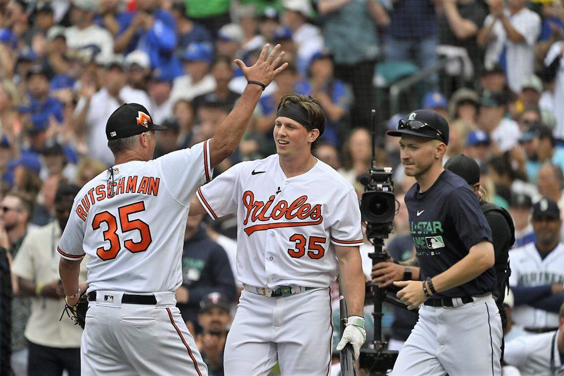 Baltimore Orioles’ Adley Rutschman, center, with his dad, Randy, at the 2023 MLB Home Run Derby at T-Mobile Park in Seattle on Monday, July 10, 2023.