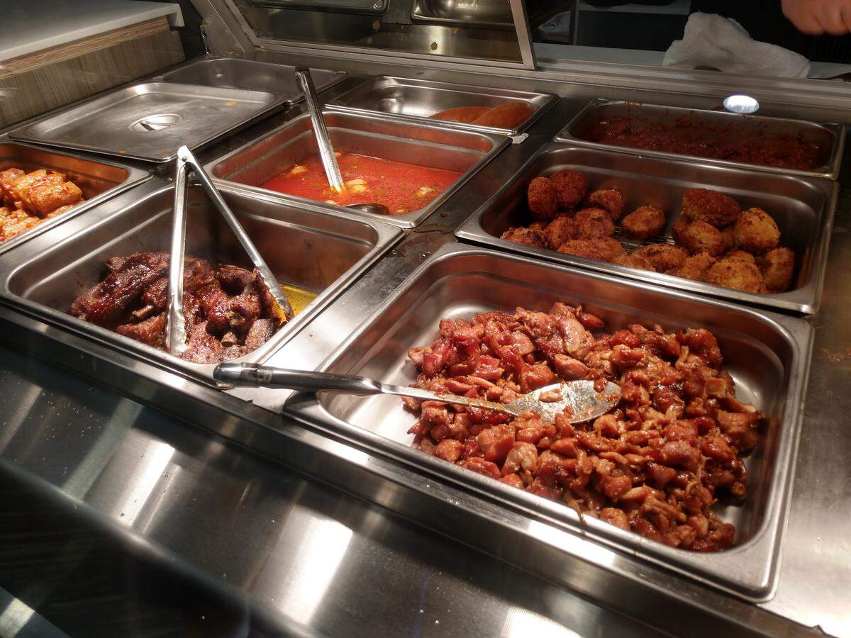 Select from a wide range of ready-to-eat items in a hot deli case at Marvel Bay Cafe.
