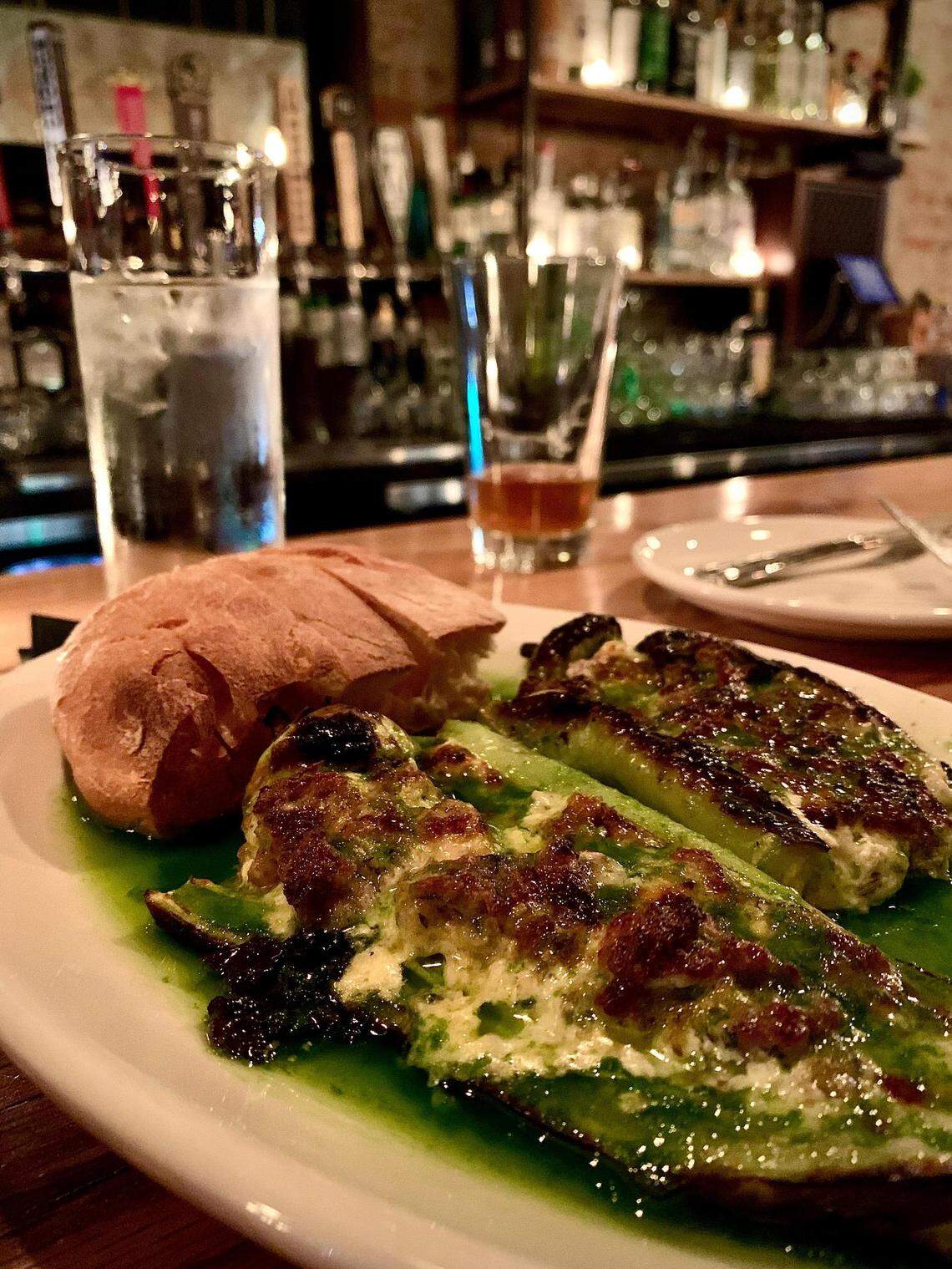 The sausage and cheese-stuffed Hungarian wax peppers at Wooden City in downtown Tacoma, Wash., arrive in a bath of deceivingly simple -- and terribly delicious -- chive oil.